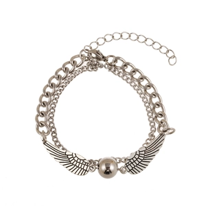 Double-layered silver chain bracelet with golden ball and angel wing pendants on white background