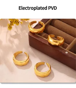 Macro detail of wide irregular hammered gold rings with PVD electroplating process