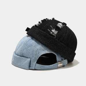 Distressed denim miki hat in black and blue with metal buckle and rolled edge