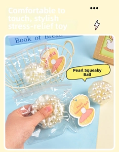 Detail of transparent stress ball toy with white pearl beads and shell gift tag