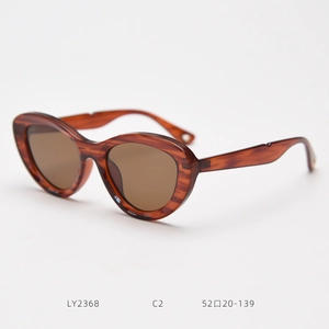 Detailed side view of tortoise shell cat-eye sunglasses with visible frame measurements