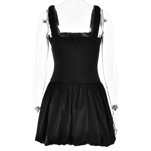 Detail view of the black mini dress back showing the zipper closure and flared hemline