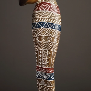 European vintage African tribal woman figurine with detailed colorful geometric patterns