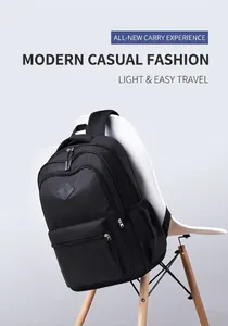 Close-up of black nylon backpack on white chair showing durable zippers and mesh pocket