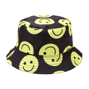 Unisex black bucket hat with vibrant yellow smiley face patterns and stitched brim