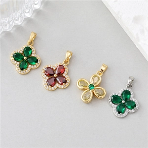 Elegant four-leaf clover and floral pendants with colorful faceted stones and gold trim