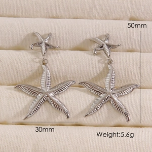 Detail view of silver double starfish earrings with dimensions 50mm height and 5.6g weight