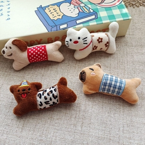 Cute plush cartoon animal dolls including dogs and bears in colorful patterned outfits