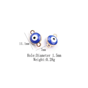 Detail of blue enamel evil eye charms with dual loops and gold-plated alloy edges