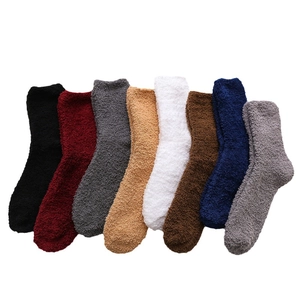 Eight pairs of thick coral fleece winter socks in various solid colors on white background