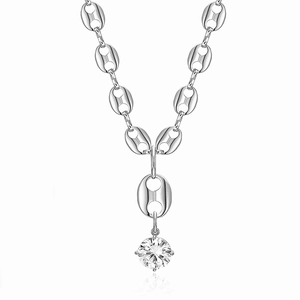 Macro shot of silver pig-nose chain necklace featuring a brilliant-cut zircon pendant