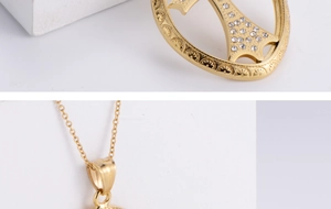 Macro detail of gold plated cross pendant with cubic zirconia stones on linked chain