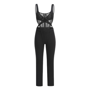Detail of sheer mesh patchwork and criss-cross strap design on a black bodysuit