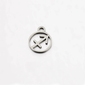 Detailed macro of a silver stainless steel Sagittarius zodiac pendant with mirror finish