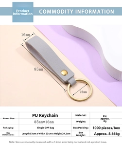 Detailed view of grey PU leather keychain with gold ring and dimensions 85mm by 16mm