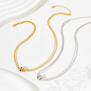 Double-layered gold and silver snake chain necklaces with crystal cylinder pendants