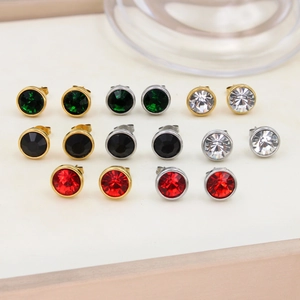 Detailed view of 10mm gold and silver stud earrings set with colorful zircon stones