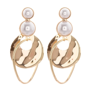 Irregular geometric gold metal earrings with faux pearl beads on white background