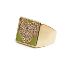 Detail of gold-plated square ring with green enamel heart and cubic zirconia stones