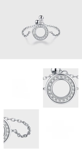Macro shot of 925 sterling silver ring featuring pave-set zircons and adjustable sliding chain