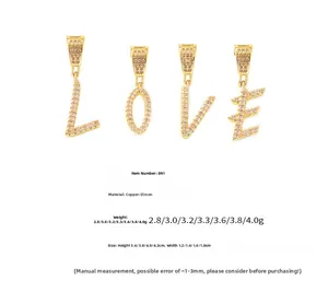 Detail view of 18k gold plated copper letter charms with micro-paved zircon crystals