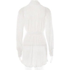 Detail of the pleated white long-sleeve shirt back with waist belt and ruffled texture