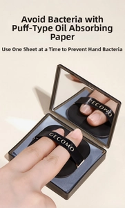 Close-up of portable bamboo charcoal oil blotting papers with puff and mirror case