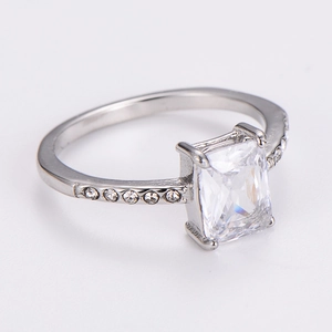 Detailed macro view of silver ring with rectangle center stone and side accents