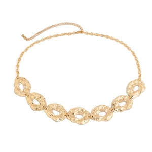 Detail view of gold irregular hammered metal disc necklace with an adjustable chain