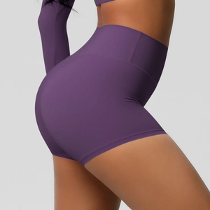 Close-up of high-waist fitness shorts showing tummy control and seamless lifting effect