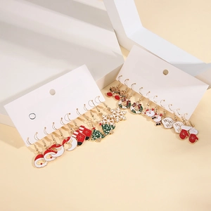 Detailed set of Christmas enamel earrings featuring Santa, reindeer, and snowflakes