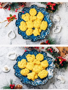 Detail of Christmas cookie cutters featuring snowman and reindeer shapes on a blue plate