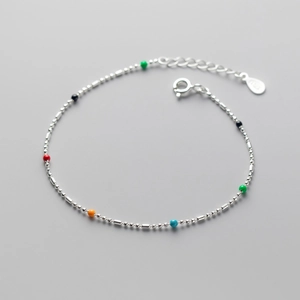 Macro detail of S925 sterling silver chain with colorful rainbow beads and spring clasp