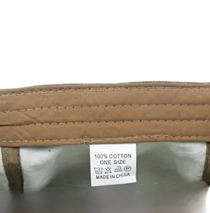 Detail view of cotton newsboy cap interior showing the sweatband and high-quality wash label