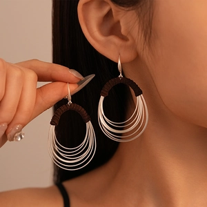 Exaggerated multi-layer circular drop earrings with brown fabric wrap bohemian style