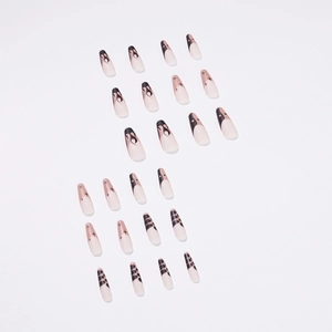Press on nails set with black flame, star, and leopard patterns on long coffin shape