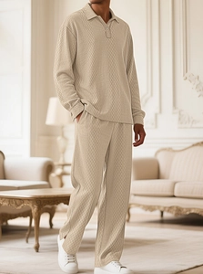 Detailed view of men's beige waffle knit texture on a long-sleeve polo and pants set