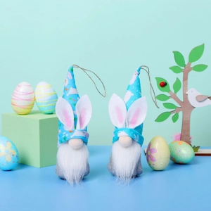 Detail of Easter gnome plush toys with bunny ears hats and colorful eggs decoration