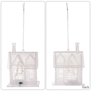 Detail view of transparent acrylic house ornament with built-in LED string lights and silver cord