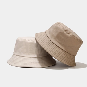 Detail of cotton twill bucket hats in beige and khaki with reinforced stitching