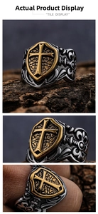Detailed views of vintage silver and gold shield cross ring with ornate engravings