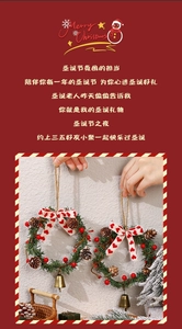 Detail of Christmas wreath with pine cones, red berries, gold bells and red ribbon bows