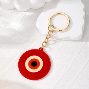 Portachiavi occhio del male rosso in acrilico con anello dorato e decorazione