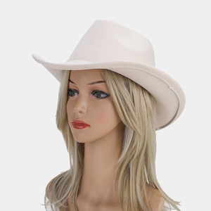Close-up of beige wide brim wool felt cowboy hat with classic indented crown design