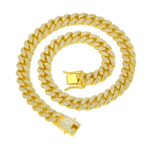 Detailed macro view of 13mm gold cuban link chain with iced-out pave cubic zirconia