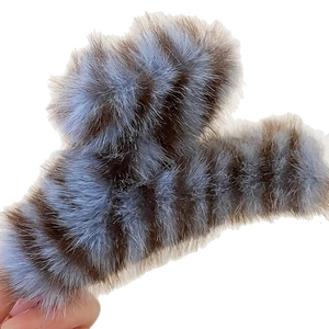 Striped plush acrylic hair claw clip in blue and brown winter faux fur accessory