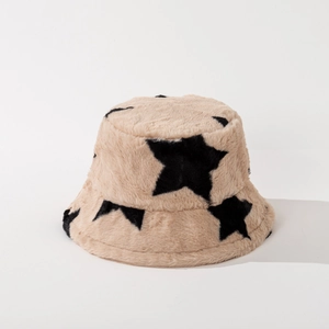 Detail of khaki faux fur bucket hat with black star patterns and soft plush texture