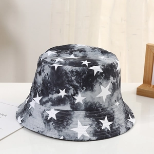 Detail of black and white tie-dye bucket hat featuring an all-over white star print pattern