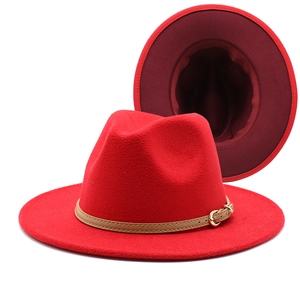 Red wool fedora hat with contrast lining and a brown leather band with golden buckle