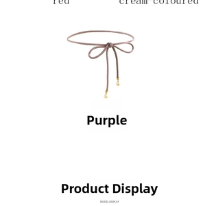 Detail of purple woven waist cord with elegant pearl charms and gold accents
